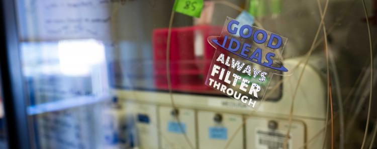 Lab equipment with a sticker that says Good Ideas Always Filter Through